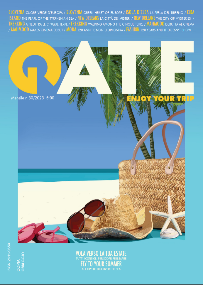 Gate magazine no. 30 cover illustrated by Sakina Zeghloul: sunglasses, wicker bag, flip-flops, starfish, and seashell placed on a beach towel over sandy background, 2023